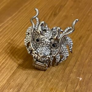 Chinese dragon ring covered in rhinestone on silver tone stretch band size 8